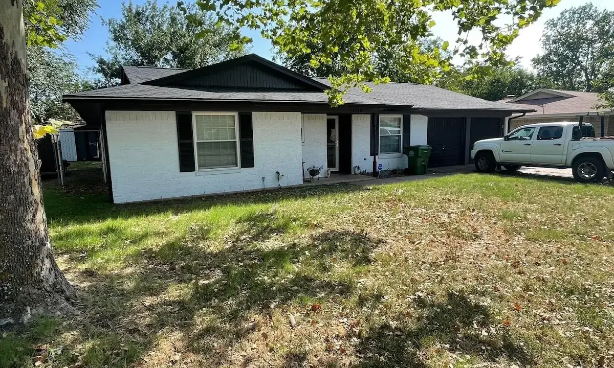 Professional roofing crew working on a residential roof in Verona